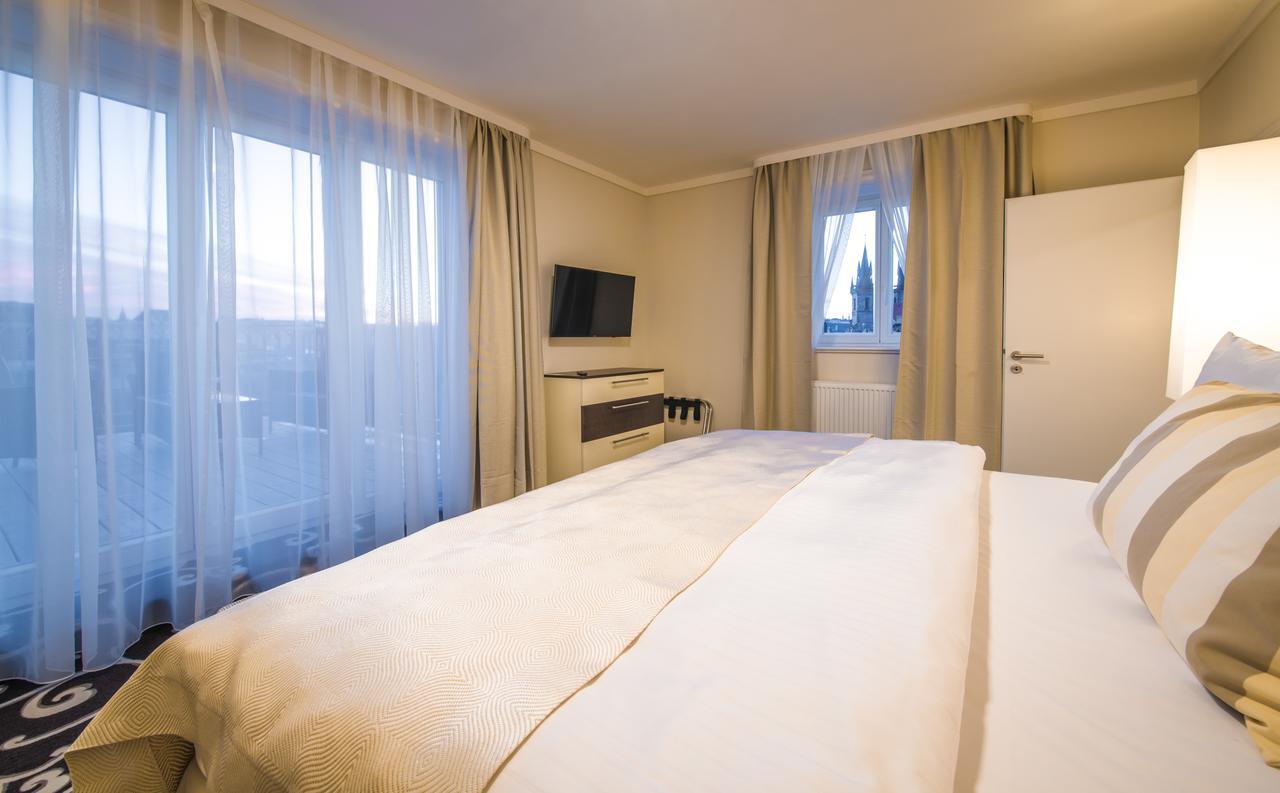 Grand Hotel Bohemia Praag Buitenkant foto A bedroom at the hotel